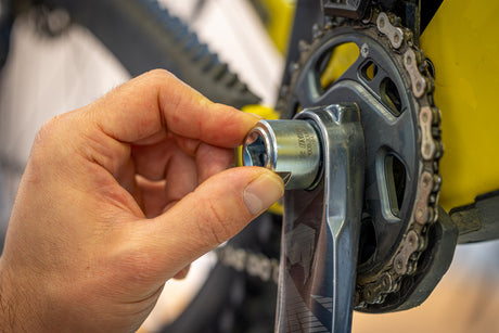 Unior Crank Cap Tool for SRAM DUB being fitted into a crank by hand