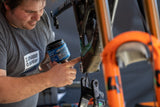 Maxima waterproof grease being packed into a bicycle suspension pivot