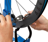 Park Tool CSH-1 Spoke Holding Pliers being used to hold a spoke on a carbon rim